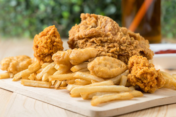 Fried chicken with nugget and french fries.