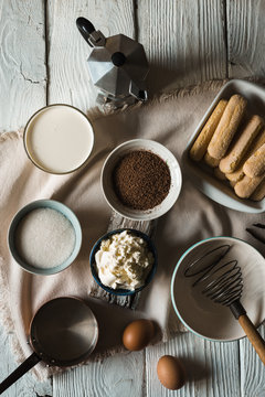 Ingredients for tiramisu on the  white wooden background