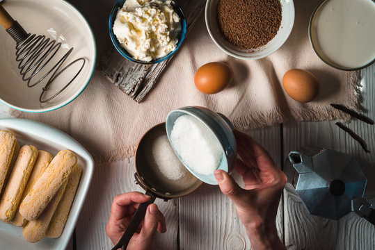 Cooking tiramisu on the white wooden table