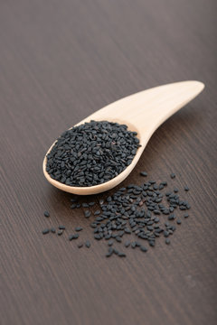 Black sesame seed on wooden spoon