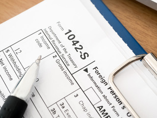 Pen on tax form 1042