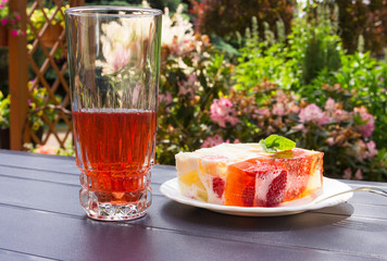 Jelly cake with strawberries on the table.