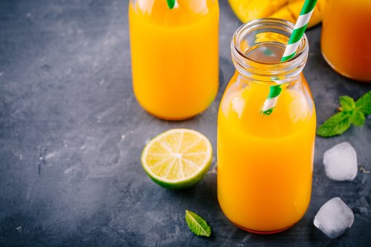 Mango orange lemonade with ice and lime