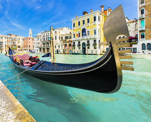 Tourists travel on gondolas at canal Venice, Italy . Gondola trip is the most popular touristic activity in Venice. © afishman64