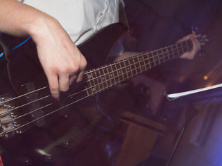 Fototapeta na wymiar Musician playing guitar in a rock band