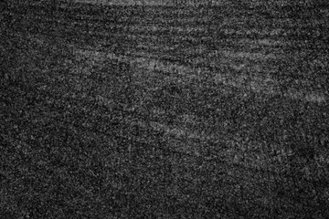 Asphalt background texture with some fine grain with road