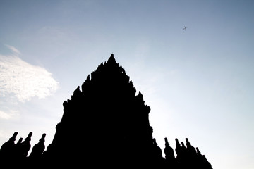 silhouette of part of prambanan temple on blue sky