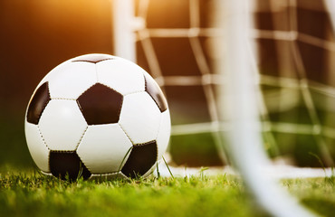 Closeup soccer ball on green grass