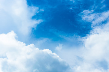 The blue backdrop has some clouds.