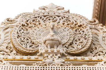 Ornament on the white granite wall of the temple in Vrndavana