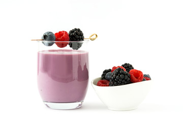 Healthy berry smoothie in glass isolated on white background
