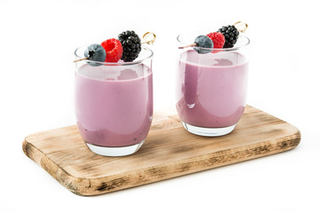 Healthy berry smoothie in glass isolated on white background
