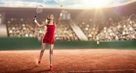 female tennis player on a tennis court ready to hit a tennis ball
