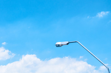 Blue sky with clouds and street light
