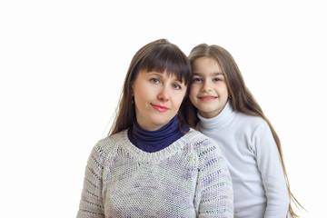 mother with her daughter hugs and smiles on camera