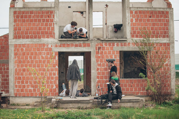 Behind the scene improvisation. Film crew filming movie scene outdoor