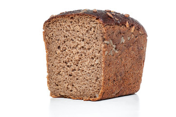 Rye and wheat bread with sunflower seeds on white background. Closeup sliced view