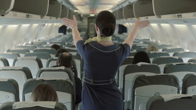 Stewardess Gives The Instructions Of Safety In Case Of Crash Airplane