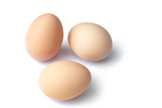 brown hen eggs on white background