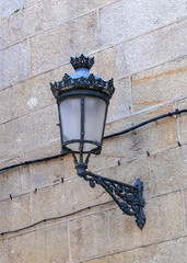 aged glass lantern on a stone wall