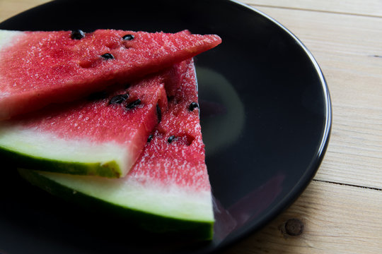 Watermelon on black plate