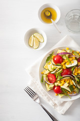 spiralized courgette salad with sweetcorn tomato avocado, healthy vegan meal