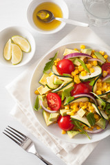 spiralized courgette salad with sweetcorn tomato avocado, healthy vegan meal