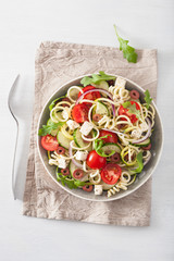 spiralized courgette salad greek style with tomato feta olives cucumber