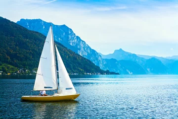 Fotobehang Zeilen Sailing boat on the lake Traunsee, Austria  © belyona