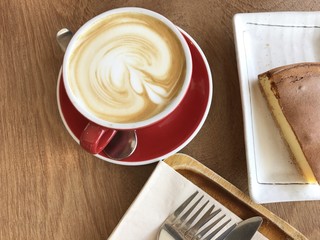 a red cup of hot latte every morning for working day