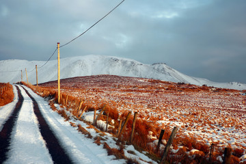Amazing landscape on Dingle Peninsula, county Kerry, in winter, country road covered with snow