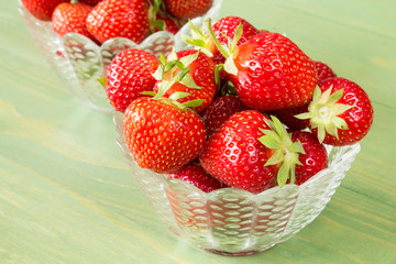 Glass bowls with red strawberries