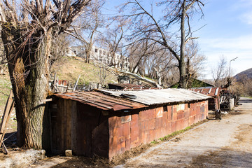 Fototapeta premium The ruins of an old house against the blue sky