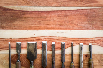 Old Chisels on wood background