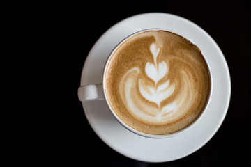 Close up of top coffee and black background.