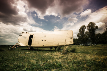 Old abandoned plane on a overgrown aerodrome