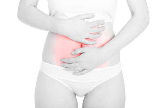 Woman with menstrual cramps, red stomachache area isolated on white, clipping path