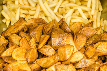 Potatoes cut into pieces with spices. Baked potatoes. Potatoes by the peasants.