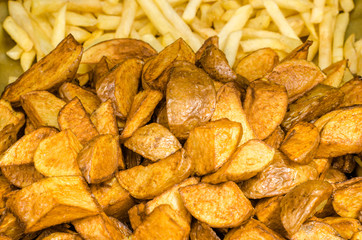 Potatoes cut into pieces with spices. Baked potatoes. Potatoes by the peasants.
