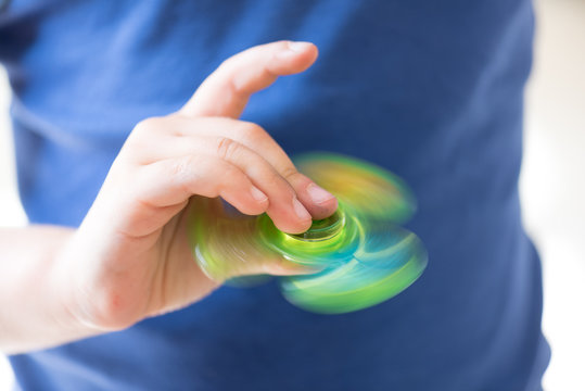 Young Girl Playing with Fidget Hand Spinner