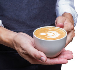 Barista holding cup latte art coffee in cafe.