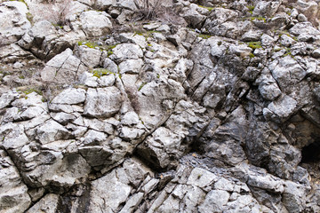 Stone cliffs in the mountains as a background
