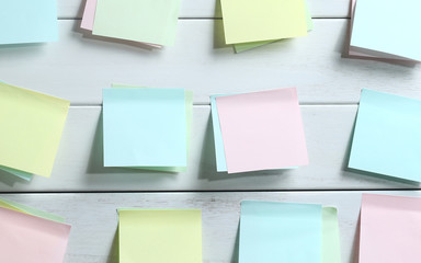 notepapers sticked on white wooden board