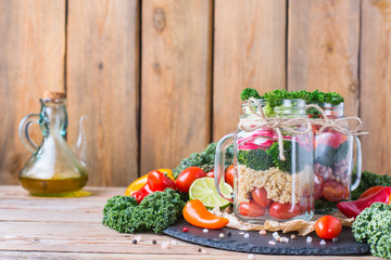 Healthy vegan salad in a mason jar with quinoa