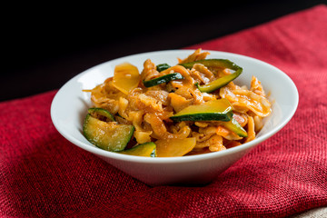 wok fried chicken stir fry with sweet peppers and chinese vegetables