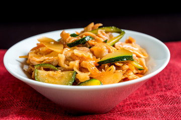wok fried chicken stir fry with sweet peppers and chinese vegetables