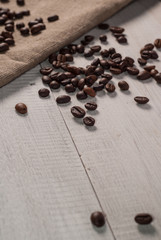 Coffee beans on sackcloth background,