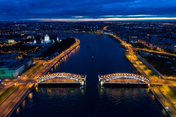 Aerial view of the night Bolsheokhtinsky bridge (The Bridge of Peter the Great) 