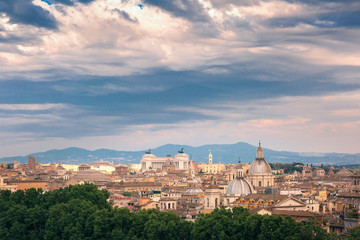 Fototapeta na wymiar Panoramic aerial wonderful view of Rome with Altar of the Fatherland and churches at sunset time in Rome, Italy