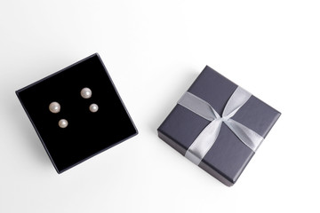 gift boxes for Pearl earrings. jewelry box on a white background. top view. gift concept.
